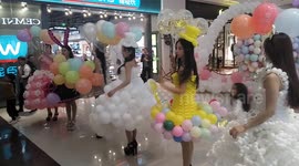 Models demonstrate unique balloon dresses at Chinese mall