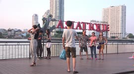 Pretty tourist posing for photos in Bangkok.