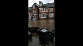Cars driving through the flooding on Bournbrook Road Selly Oak