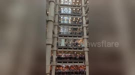 Poppies fall from the sky as Lloyds of London marks Remembrance Day