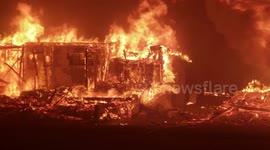 Burning building ravaged by Camp Fire