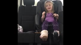 2 year old feeds cat in high chair