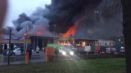 Firetrucks arrive as massive blaze engulfs Lenta hypermarket in St. Petersburg
