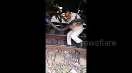 Shocking Moment Train starts moving with guard mending glitch, escapes unhurt in India