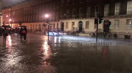 WEATHER London tourists caught in rain