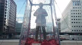 Poppies flutter around soldier statue on Remembrance Sunday