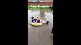Student floats in a Rubber Ring during the Selly Oak Floods