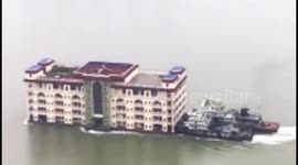 'Floating apartment building' boat moved downriver in China
