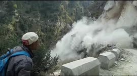 Alert Indian villagers stop in time to dodge landslide