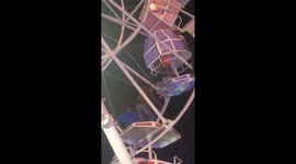 Ferris wheel gondolas flip upside down with families inside in Indonesia