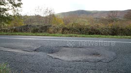 Pothole on a country road in Cumbria