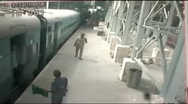 Hero cop saves woman from slipping under moving train