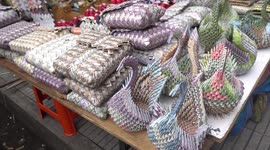 Venezuelan migrants sell handcrafts made of worthless money in Colombia