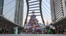 Commuters traveling from Work around a giant Christmas tree