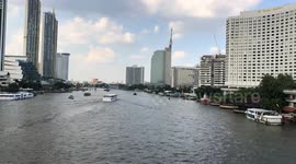 Time-lapse of boats traveling along a river