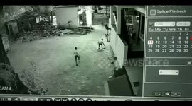 Amazing accidental save as boy breaks his friend's fall from third floor balcony