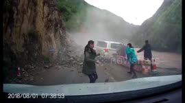 Mountainside collapses almost shunting family car into river