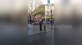Adorable moment old man catches passing balloon and hands it to woman
