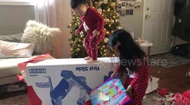 Christmas Fail! Child falls off present!