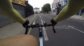 Car pulls out across cycle lane, cyclist takes avoiding action