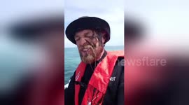 In your face! Funny moment Aussie fisherman gets inked by slippery squid