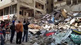 Palestinians inspect damage after Israeli airstrike on residential area in Gaza City
