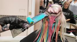 Hairdresser uses paint rollers to give clients' hair a rainbow hue