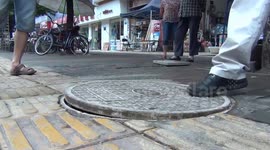 Bizarre dancing manhole cover in China