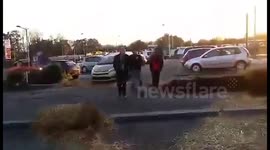 French farmers dump manure outside McDonald's restaurant in protest