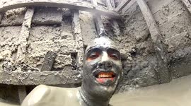 Thrill seekers take bath in Colombia's mud volcano