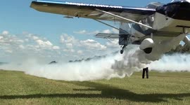 Two airplanes make a low-pass between a man