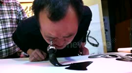 Man uses eye socket to paint calligraphy