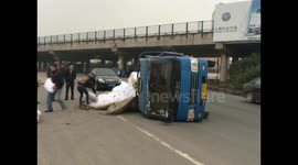 Overloaded truck topples over in China