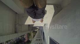 Handstand on a ledge 24 storeys up Singapore tower