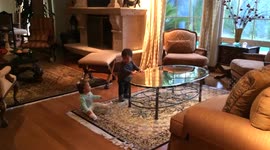 Adorable baby girl makes her twin brother laugh