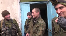 LNR fighters move through Nikishyne under fire from Ukrainian armed forces