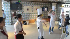 Restaurant staff dance for diners in China