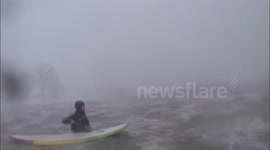 Surfers brave snow storm on Lake Erie