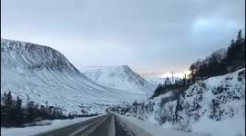 Driving through snow covered beautiful Tablelands, Newfoundland