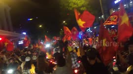 Vietnamese football fans celebrate the victory in ASEAN group stage