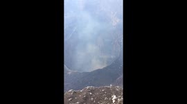 Tourists film spectacular view of inside Nicaragua's Masaya volcano