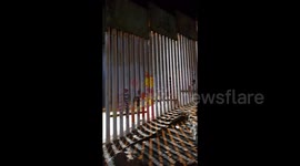 US installs new security at border wall as migrants arrive in Tijuana