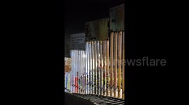 US installs new security at border wall as migrants arrive in Tijuana