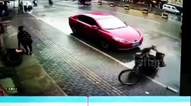 Three-wheeler driver gets knocked into his own trailer in funny car accident