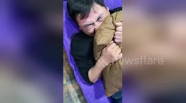Chinese husbands experience childbirth pain in educational expo