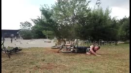 BMX rider lands flat on his back attempting crazy trick jump