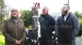 Astonishing 8ft DRAGON sculpture was ‘flown’ into a quaint back garden - and captured the imagination of villagers and schoolchildren alike