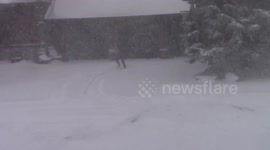 Man plays basketball during blizzard