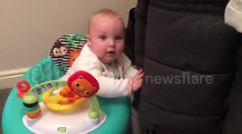Baby excited by coats