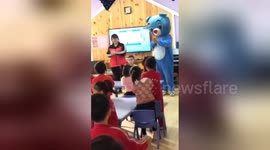 Mother in bear costume surprises son in school on his birthday